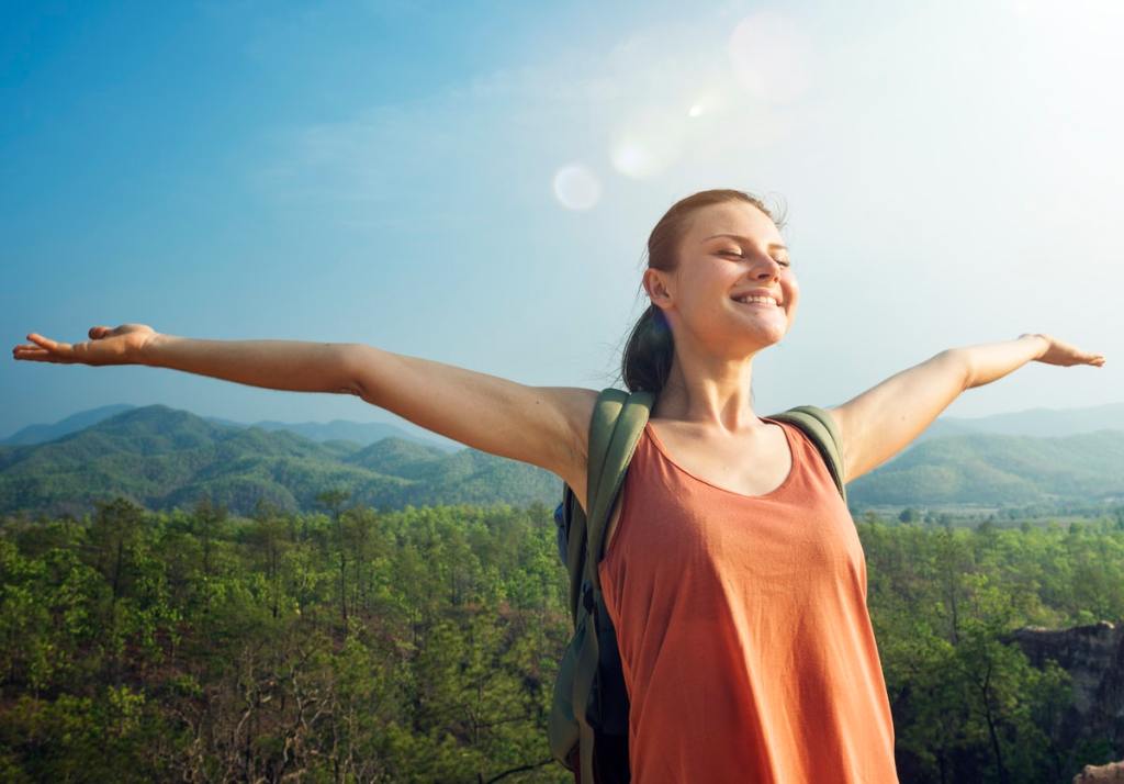 Woman outdoors breathing for Progressive Relaxation