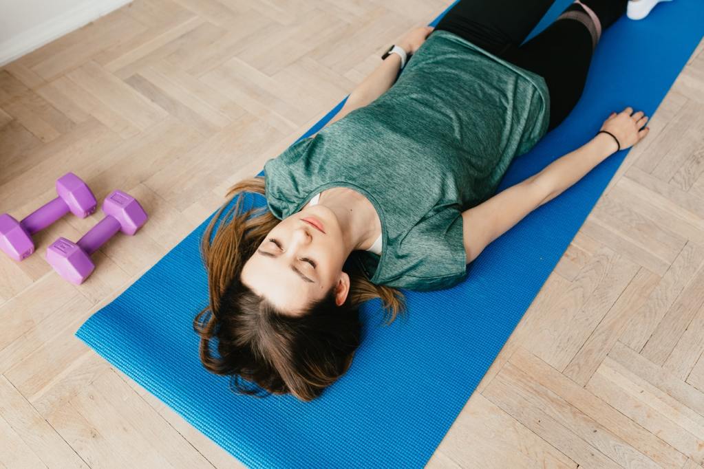 Progressive Relaxation - Woman laying on a mat