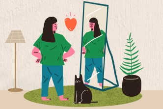 Woman looking at herself in the mirror with compassion