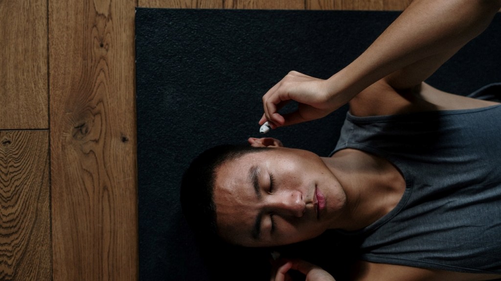 Man laying on floor picturing and visualizing healthy thoughts