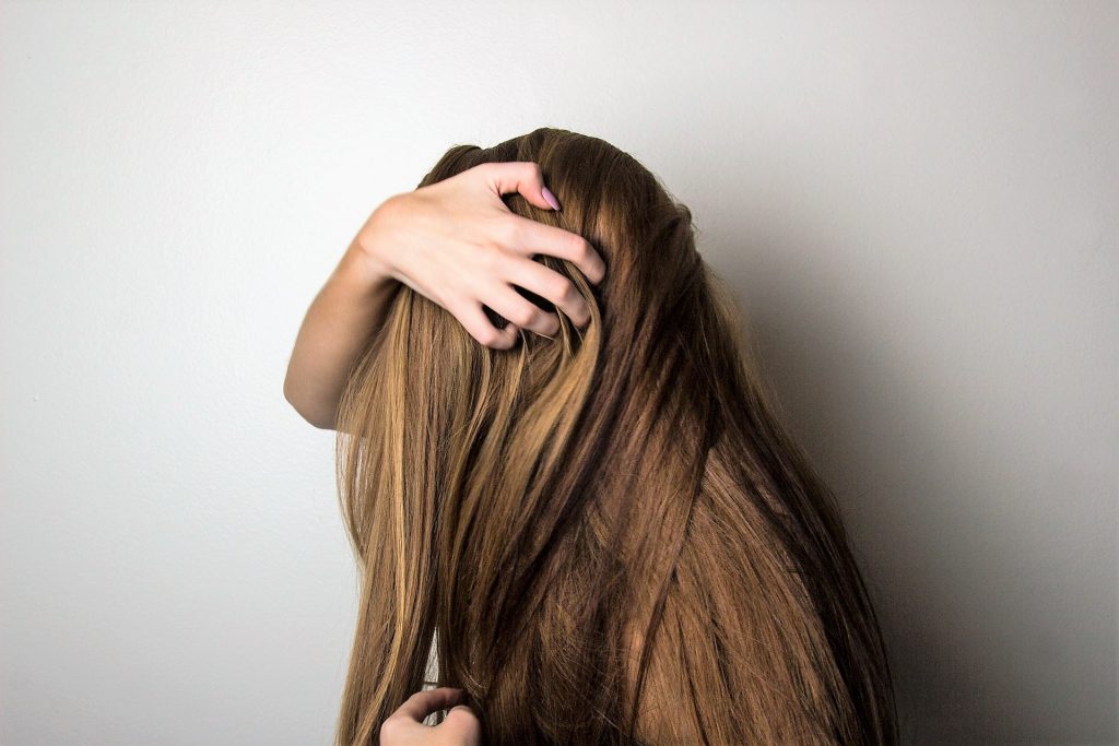 Woman Holding Her Hair