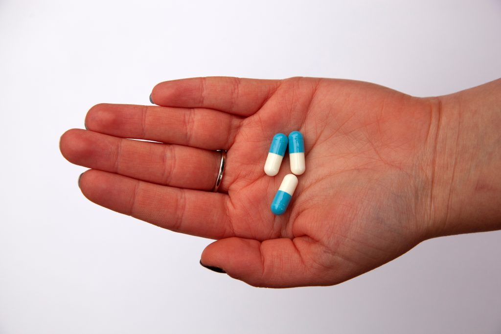 Person taking some medicine