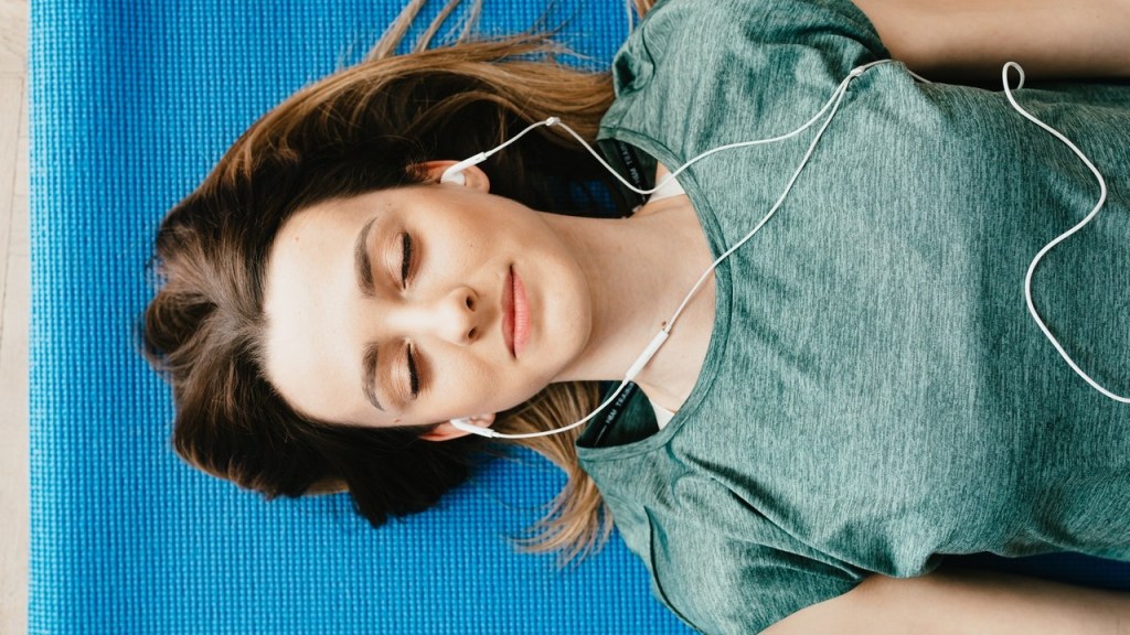Woman laying down using guided imagery to think herself well