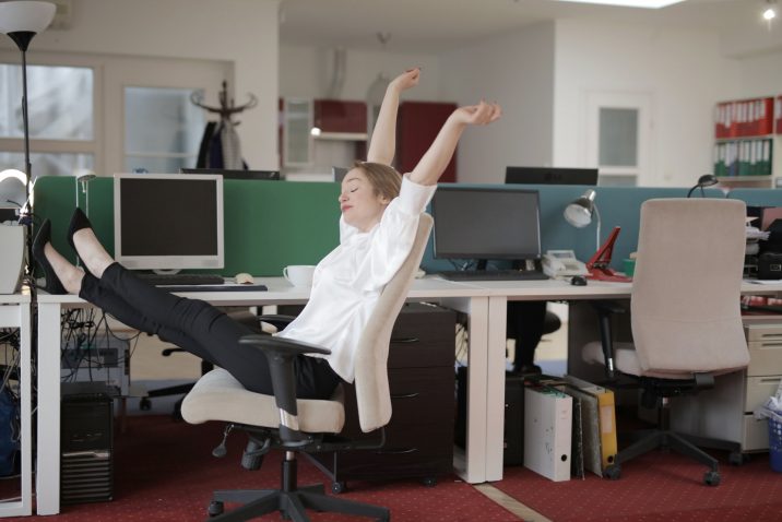 Woman stretching at her computer