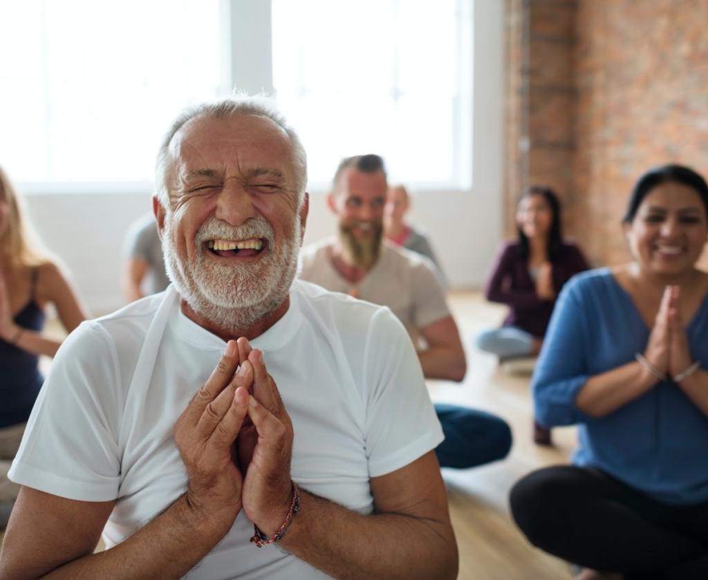 Happy people doing yoga- building a strong health foundation