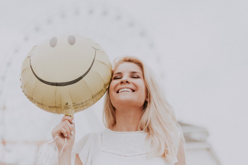 A happy woman with a balloon