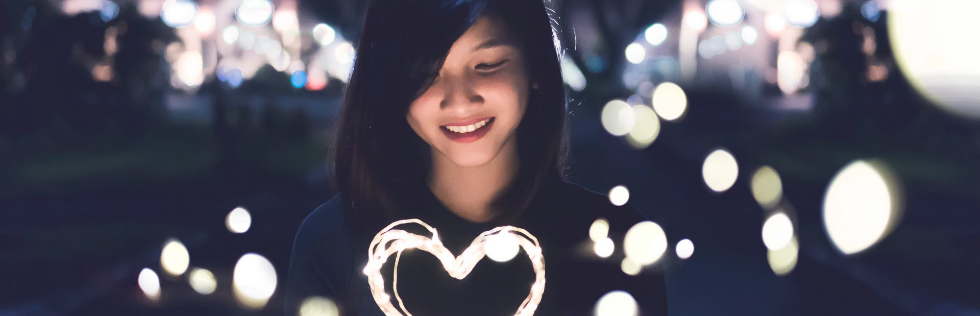 woman holding a heart