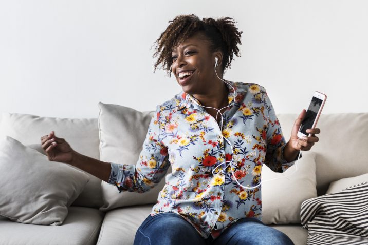 Woman loving life while listening to music