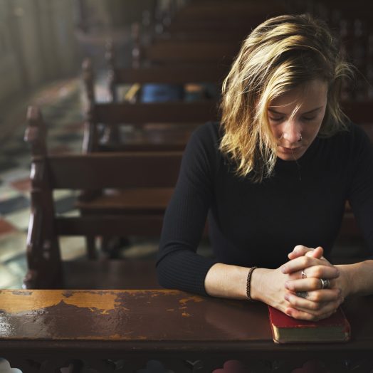 A woman praying in earnest