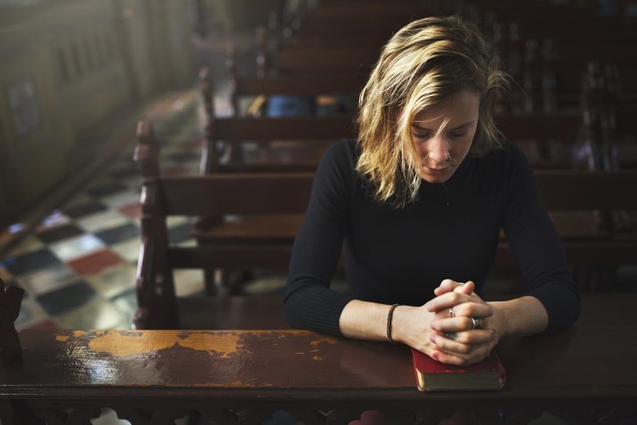 A woman praying in earnest