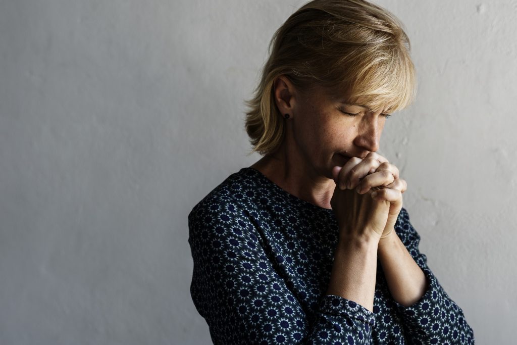Woman Praying and Finding Spiritual Companionship