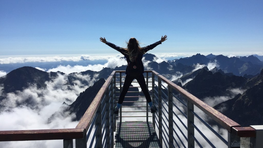 Woman overlooking mountains - getting what you want