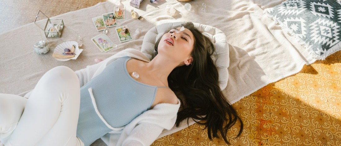 Woman laying on floor developing her spiritual self