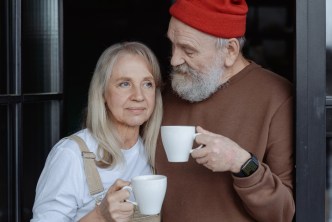 Menopausal woman and man drinking coffee