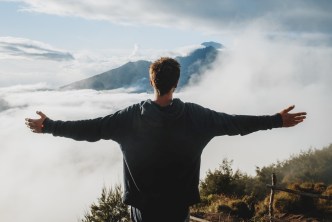 Man on mountain glimpses beyond normal life