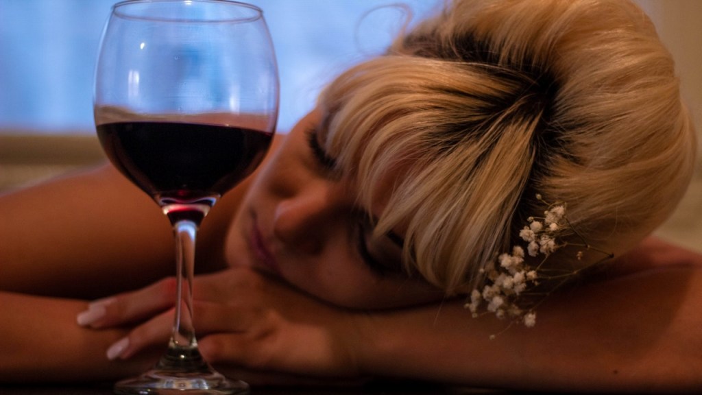 Woman sleeping after drinking wine